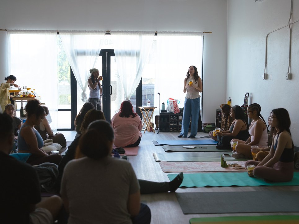 Desiree leading a corporate wellness session with a team